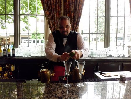 Bartender at Oliver's in the Mayflower Park Hotel preparing our Downton Abbey martinis